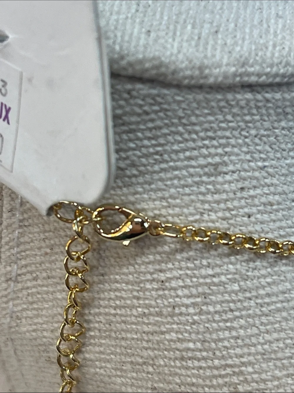 Gold-Tone Necklace with Beige Center and Green Crystal Halo